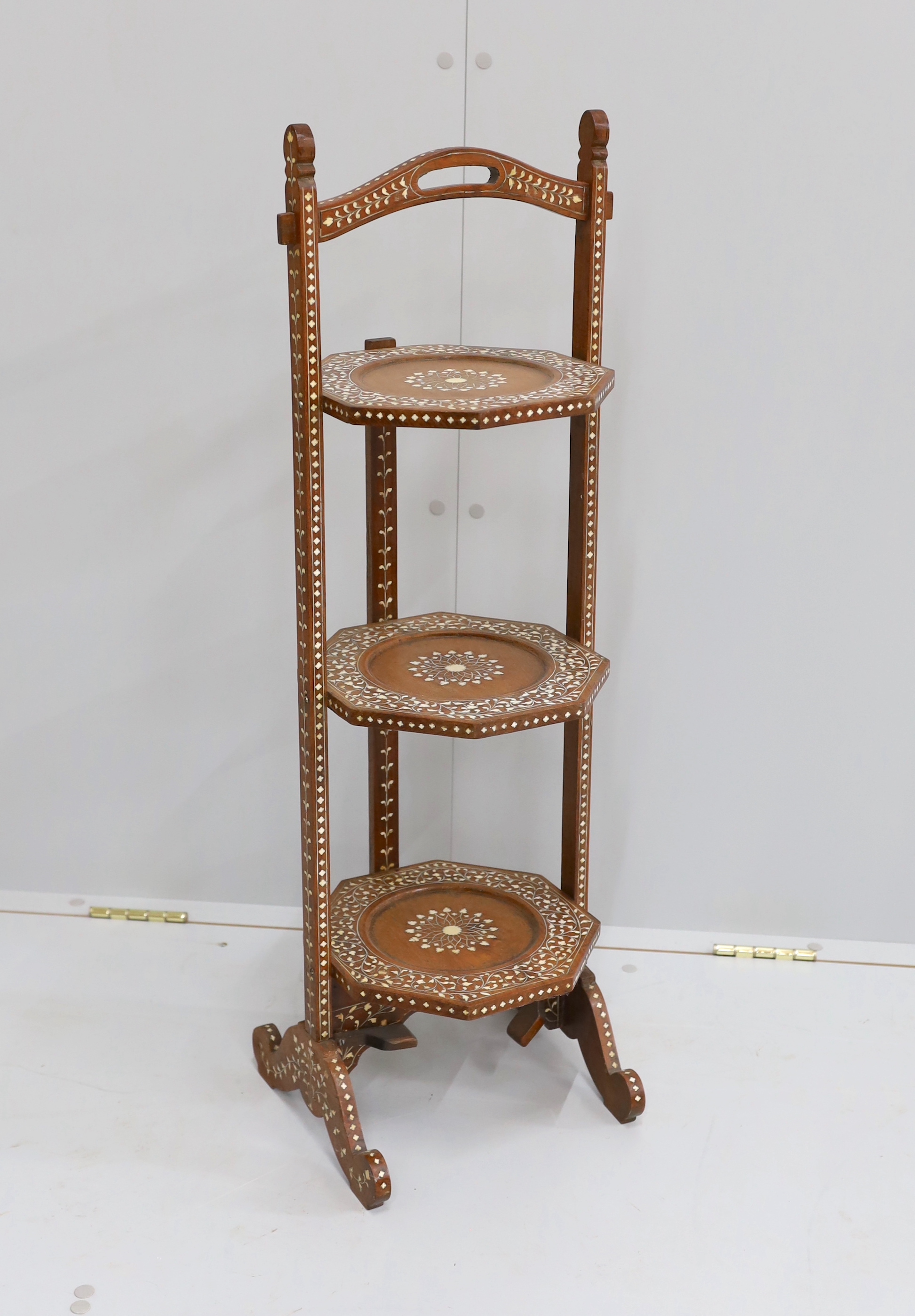 A George III style mahogany wash stand, together with an Indian bone inlaid three tier folding cake stand